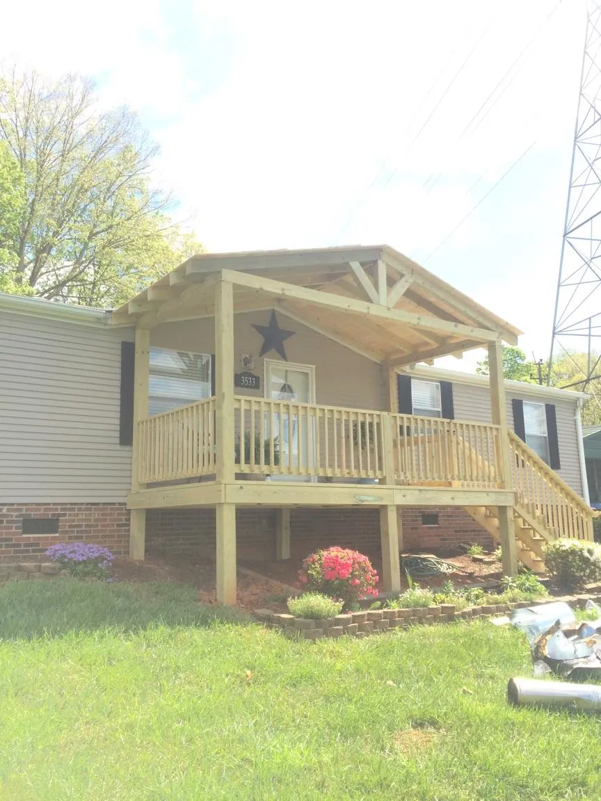New gabled porch roof and deck railing added to a ranch home in Fillmore